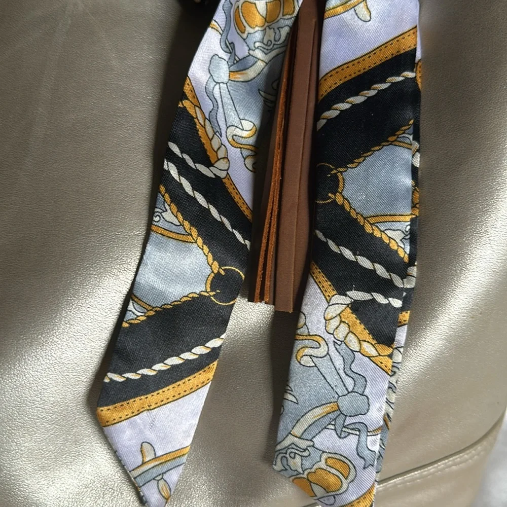 Brown TASSEL KEYCHAIN/bag charm with detachable scarf.